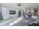 Open living room with sectional sofa and kitchen view at 10421 E Cliffrose Ln, Florence, AZ 85132
