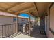 Covered balcony with seating area and views of surrounding buildings at 1069 N 84Th Pl, Scottsdale, AZ 85257