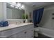 Clean bathroom with a white vanity and blue accents at 1069 N 84Th Pl, Scottsdale, AZ 85257