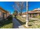 Landscaped grounds with a tree-lined walkway and building exteriors at 1069 N 84Th Pl, Scottsdale, AZ 85257