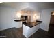 Well-lit kitchen boasts stainless steel appliances, black countertops, and white cabinetry at 1069 N 84Th Pl, Scottsdale, AZ 85257