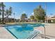 Community pool with lounge chairs and surrounding landscaping at 1069 N 84Th Pl, Scottsdale, AZ 85257