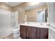 Double vanity bathroom with dark brown cabinets and a shower/tub combo at 10789 W Saddlehorn Rd, Peoria, AZ 85383