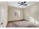 Bright bedroom with carpeted floor and ceiling fan at 10789 W Saddlehorn Rd, Peoria, AZ 85383
