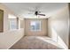 Bedroom with neutral walls, carpet, and a ceiling fan at 10789 W Saddlehorn Rd, Peoria, AZ 85383