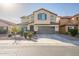 Two-story house with a brown garage door and landscaping at 10789 W Saddlehorn Rd, Peoria, AZ 85383