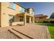 Two-story house with backyard patio and brickwork at 10789 W Saddlehorn Rd, Peoria, AZ 85383