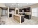 Kitchen with dark brown cabinets and granite countertops at 10789 W Saddlehorn Rd, Peoria, AZ 85383