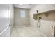 Laundry room with shelving and tile floor at 10789 W Saddlehorn Rd, Peoria, AZ 85383