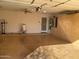 Garage with built-in storage, epoxy floor, and ceiling fan at 1120 S 232Nd Ave, Buckeye, AZ 85326