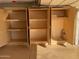 Garage features ample storage with built-in shelving units at 1120 S 232Nd Ave, Buckeye, AZ 85326