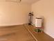 Garage with water softener, dehumidifier, and storage at 1120 S 232Nd Ave, Buckeye, AZ 85326