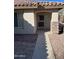 Inviting house exterior featuring a tile roof, stone accents, and a paved walkway at 1120 S 232Nd Ave, Buckeye, AZ 85326