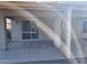 Covered patio with sliding glass doors leading to the backyard at 1120 S 232Nd Ave, Buckeye, AZ 85326