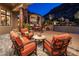 Inviting patio space with comfortable seating, stone flooring, and a peaceful outdoor setting at 11237 E Troon Mountain Dr, Scottsdale, AZ 85255