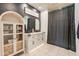 Modern bathroom with double vanity, stylish lighting, and a large shower at 11271 E Sunflower Ct, Florence, AZ 85132