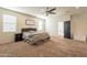 Spacious main bedroom with ceiling fan and access to the backyard at 11271 E Sunflower Ct, Florence, AZ 85132