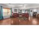 Living room with two sofas, hardwood floors, and a decorative wall at 11868 W Kinderman Dr, Avondale, AZ 85323