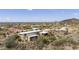 Aerial view of a contemporary home with desert landscape and mountain views at 135 E Tonto St, Apache Junction, AZ 85119