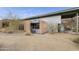 Contemporary home with metal siding and desert landscaping at 135 E Tonto St, Apache Junction, AZ 85119