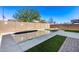 Refreshing backyard pool with artificial turf and fire pit at 14428 W Faye Way, Surprise, AZ 85387