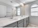 Double vanity bathroom with arched windows at 14428 W Faye Way, Surprise, AZ 85387