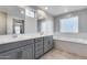 Double vanity bathroom with a soaking tub at 14428 W Faye Way, Surprise, AZ 85387