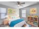 Charming bedroom with light bedding and built in shelving at 14428 W Faye Way, Surprise, AZ 85387