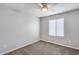 Bedroom with window and ceiling fan at 14428 W Faye Way, Surprise, AZ 85387