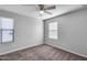 Bedroom with two windows and ceiling fan at 14428 W Faye Way, Surprise, AZ 85387