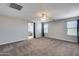 Bedroom with ensuite bathroom and carpet flooring at 14428 W Faye Way, Surprise, AZ 85387