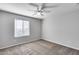 Bedroom with ceiling fan and window blinds at 14428 W Faye Way, Surprise, AZ 85387