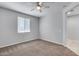 Simple bedroom with carpet and ceiling fan at 14428 W Faye Way, Surprise, AZ 85387