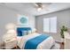 Serene bedroom with blue accents and a comfortable bed at 14428 W Faye Way, Surprise, AZ 85387