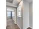 Hallway with access to bedroom and window at 14428 W Faye Way, Surprise, AZ 85387