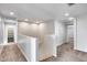 Upstairs hallway with access to bedrooms and closet at 14428 W Faye Way, Surprise, AZ 85387