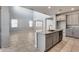 Open concept kitchen with granite island and stainless steel appliances at 14428 W Faye Way, Surprise, AZ 85387