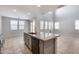 Modern kitchen with granite countertops and stainless steel appliances at 14428 W Faye Way, Surprise, AZ 85387
