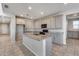 Spacious kitchen with granite island and stainless steel appliances at 14428 W Faye Way, Surprise, AZ 85387
