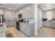 Modern kitchen with gray cabinets and granite countertops at 14428 W Faye Way, Surprise, AZ 85387