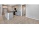 Modern kitchen with a breakfast bar and granite countertops at 14428 W Faye Way, Surprise, AZ 85387