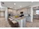 Modern kitchen with granite countertops, stainless steel appliances, and an island at 14428 W Faye Way, Surprise, AZ 85387