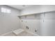 Laundry room with shelving and drain at 14428 W Faye Way, Surprise, AZ 85387