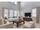 Spacious living room featuring high ceilings and large windows at 14428 W Faye Way, Surprise, AZ 85387
