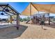 Community playground with shade structure and seating at 14428 W Faye Way, Surprise, AZ 85387