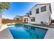 Enjoy this beautiful pool with a view of the home and backyard at 14428 W Faye Way, Surprise, AZ 85387