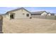 Large backyard with gravel and block wall at 1615 S 239Th Dr, Buckeye, AZ 85326