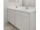 Bathroom with double vanity and white cabinets at 1615 S 239Th Dr, Buckeye, AZ 85326