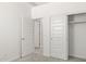 Bedroom with sliding closet doors and carpet at 1615 S 239Th Dr, Buckeye, AZ 85326