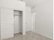 Bedroom with sliding closet doors and carpet at 1615 S 239Th Dr, Buckeye, AZ 85326